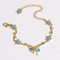 Bracelet doré orné de breloques en zircon bleu en forme de nœud et de fleurs - Bleu Or