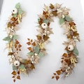 Artificial Thanksgiving garland with maple leaves and white pumpkins on white wall - 2.7m Wire Pumpkin Garland