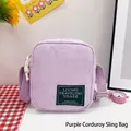 Light purple corduroy crossbody bag with adjustable strap and green fabric patch - Purple
