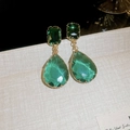 Macro shot of vintage style earrings with green water-drop crystals and golden frames - Double Teardrop Green Gem Drop (Silver Earring Post)