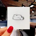 Detailed view of a cute white polar bear enamel pin badge on a cardboard backing - 28*Cute White Bear Pin
