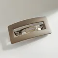 Matte apricot rectangle spring hair clip with minimalist hollow metal design - Khaki