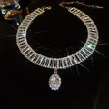 Luxury sparkling rhinestone choker with a large teardrop pendant on dark background - Silver