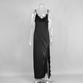 Detail view of high side slit with black lace trim on a long satin slip dress - S / Black