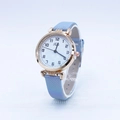 Women's quartz watch with gradient blue strap and rose gold numeral dial on a stand - Sky Blue