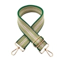 Dettaglio della tracolla intrecciata verde e beige con fibbie in metallo dorato lucido - Verde