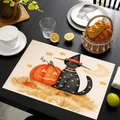 Macro detail of Halloween place mat featuring a black cat with witch hat and pumpkins - Style 3
