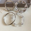 Detailed view of assorted silver metallic and clear acrylic irregular geometric bracelets. - Multi-Piece Combination Set (53#) / Silver