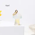 Mini mushroom pendant made of translucent opal gemstone with a golden metal ring - Opal