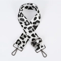 Macro shot of leopard print replacement bag strap with dark grey metal lobster hooks - White With Gunmetal Buckle