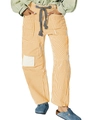 Detail of orange striped pants featuring drawstring waist and cargo side pockets - S / Yellow