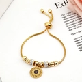 Adjustable golden snake chain bracelet featuring a blue enamel evil eye charm - Gold Tone - Sun Evil Eye