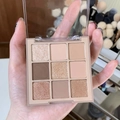 Macro view of the nine-color eyeshadow palette with matte and shimmer neutral textures - No. 05 Nude Pink Base Earth Tones