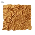 Silk satin square scarf detail view showing soft matte texture and elegant golden drape. - Lotus root pink