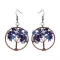 Close-up of handmade Tree of Life wire wrapped earrings with blue natural crystal stones - Antique Copper + Lapis Lazuli