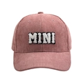 Detailed close-up of pink corduroy texture and white plush MINI embroidery on baseball cap - MINI Style / Pink