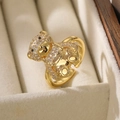 Close-up of a teddy bear ring in 18K gold plating with sparkling white cubic zirconia - Adjustable Open / Gold/White Zirconia