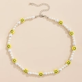 Layered necklace featuring white pearls and yellow smiley face beads with silver clasp - Yellow Smiley Face