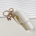 White mini tumbler keychain with golden ring and small Santa Claus charm pendant - Christmas White