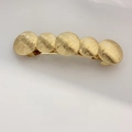 Elegant gold spring hair clip with five textured circular discs in a row design - Ribbed Disk Chain Gold