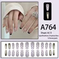 Set de uñas postizas rosa y negro con diseño floral y acabado metálico, 24 piezas - Estilo Espejo Metálico con Puntos Negros Rosa Pálido (A764)