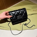 Black quilted crossbody bag with silver chain strap and metal twist lock closure - Black Large