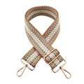 Detail of adjustable wide woven shoulder strap with geometric diamond pattern and gold hardware - Khaki