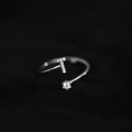 Elegant adjustable silver ring featuring a sparkling zircon stone and a micro-paved letter T - Letter T