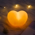 Close-up of heart-shaped night light with warm orange glow on white plush rug - Large Size with OPP Bag / Pink