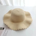 Detail of beige straw hat featuring fine weave texture and scalloped wavy edge design - Kids / Plain Style / Beige