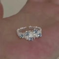 Irregular textured silver open ring with five blue zircon stones on person's hand - Lava Texture Blue Five Stones Open Ring / Silver (Blue Zirconia)