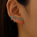 Three-piece gold earring set with sky blue floral studs and crystal hoops on ear - Sky Blue Flower Cluster Style (1896)