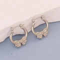 Polished silver stainless steel hoop earrings with elegant bow knot design detail - Silver Style K7-24