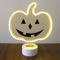 Neon pumpkin light with yellow glowing LED frame and jack-o-lantern face on white base - 2023 New Pumpkin
