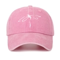 Close-up of pink washed cotton baseball cap featuring a white dragonfly print detail - One Size / Pink