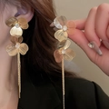 Golden flower tassel earrings with crystals and vintage metallic texture on model - Stereo Brushed Flower Rhinestone Tassel (15#) / Gold