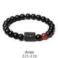 Detail of Aries beaded bracelet featuring polished black onyx beads and engraved cylinder - Aries