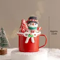 Christmas snowman themed decorative red mug ornament with bow and festive elements, 11cm high - Snowman Cup