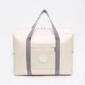 Beigefarbene faltbare Reisetasche mit Trolley-Schlaufe und rundem Flugzeug-Logo - Beige