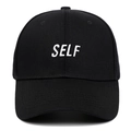 Classic black cotton baseball cap featuring white SELF embroidery on the front center - Adjustable / Black