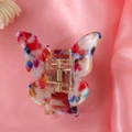 Macro shot of butterfly hair clip featuring colorful acetate patterns on pink silk - 11# Colorful Speckled Butterfly Claw Clip