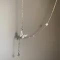 Elegant butterfly pendant necklace with sparkling crystals and a white pearl accent - XL837 Silver Stainless Steel Chain