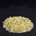 Close-up of natural raw yellow crystal chips with high transparency for home decoration - Citrine / 100 g