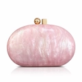 Close-up of pink acrylic shell bag featuring marble texture and gold metal clasp detail - Pink