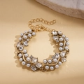Detalle de cierre de langosta ajustable y cadena de extensión en pulsera de perlas - Pulsera - Dorado