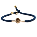 Adjustable dark blue braided rope bracelet with golden lion head charm on white background - Lion Head / Blue