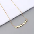Detailed close-up of a gold hexagonal pendant necklace with micro-pave cubic zirconia stones - Necklace / Gold