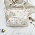Quilted cream cosmetic bag with cartoon dog pattern and bow tie detail - Colorful Star Puppy