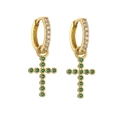 Detailed shot of golden hoop earrings with cross pendants and emerald green gemstones - Gold Green Zircon Cross