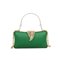 Green sparkling evening clutch bag featuring a gold leaf-shaped clasp and metal handle - Green
